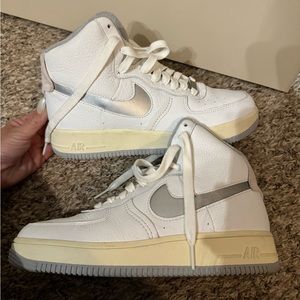 Gray and white Nike high top shoes